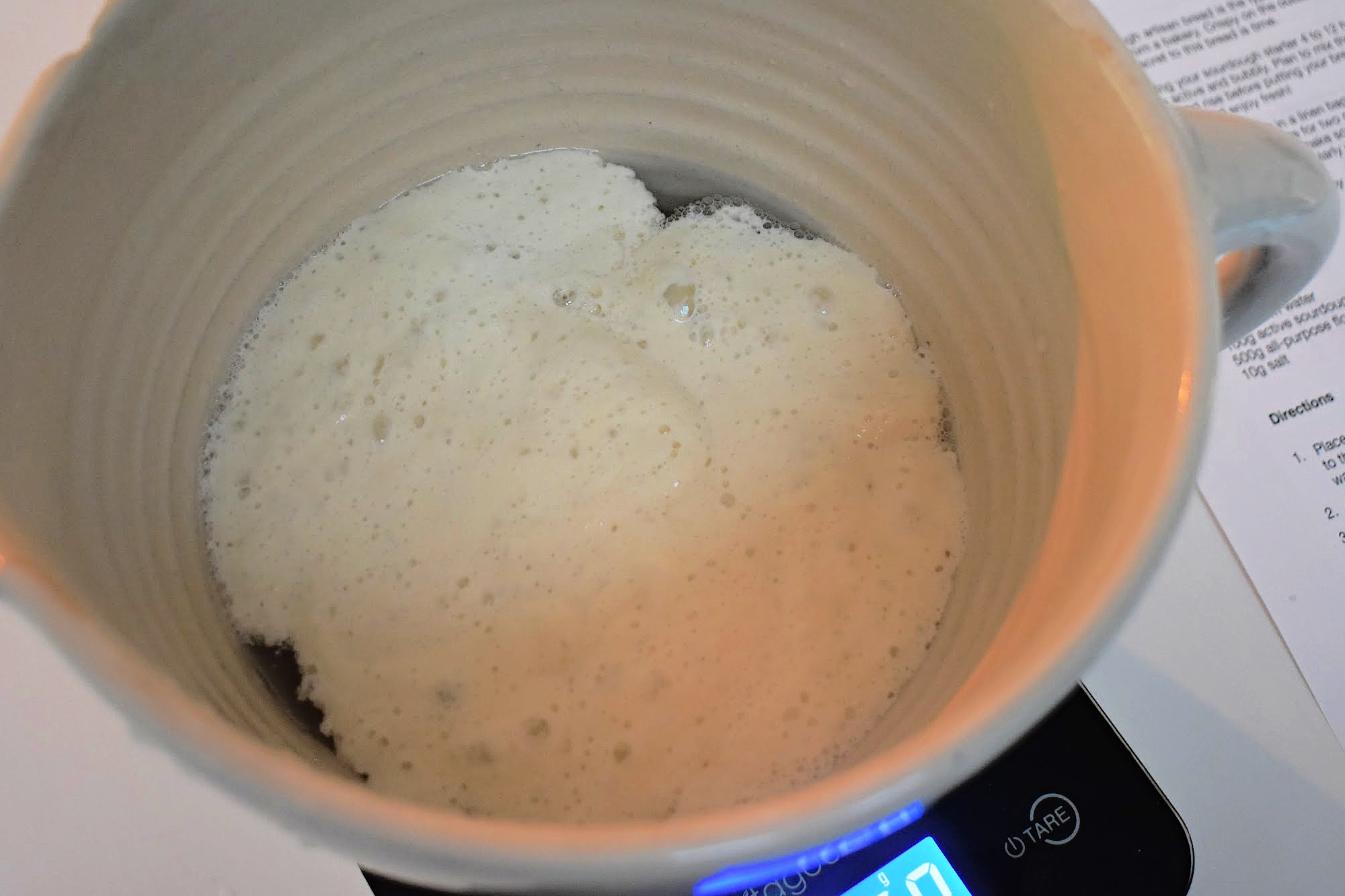 Sourdough float test in mixing bowl.