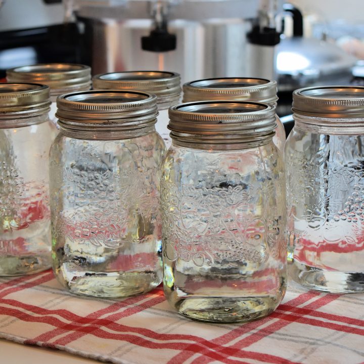 Mason jars of canned water. | How to Can Water for Emergencies